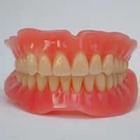 Injection Moulded Denture - Specialized technique for better fit and comfort.